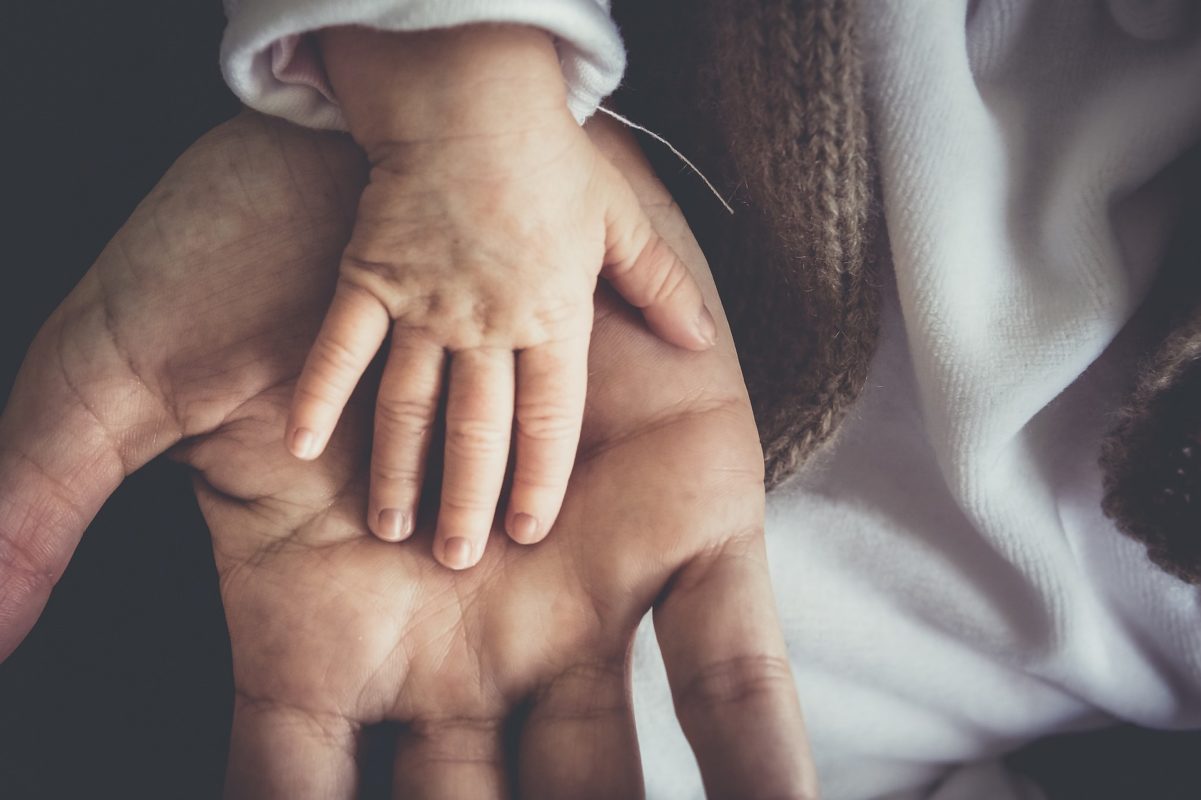 Dad and child hands